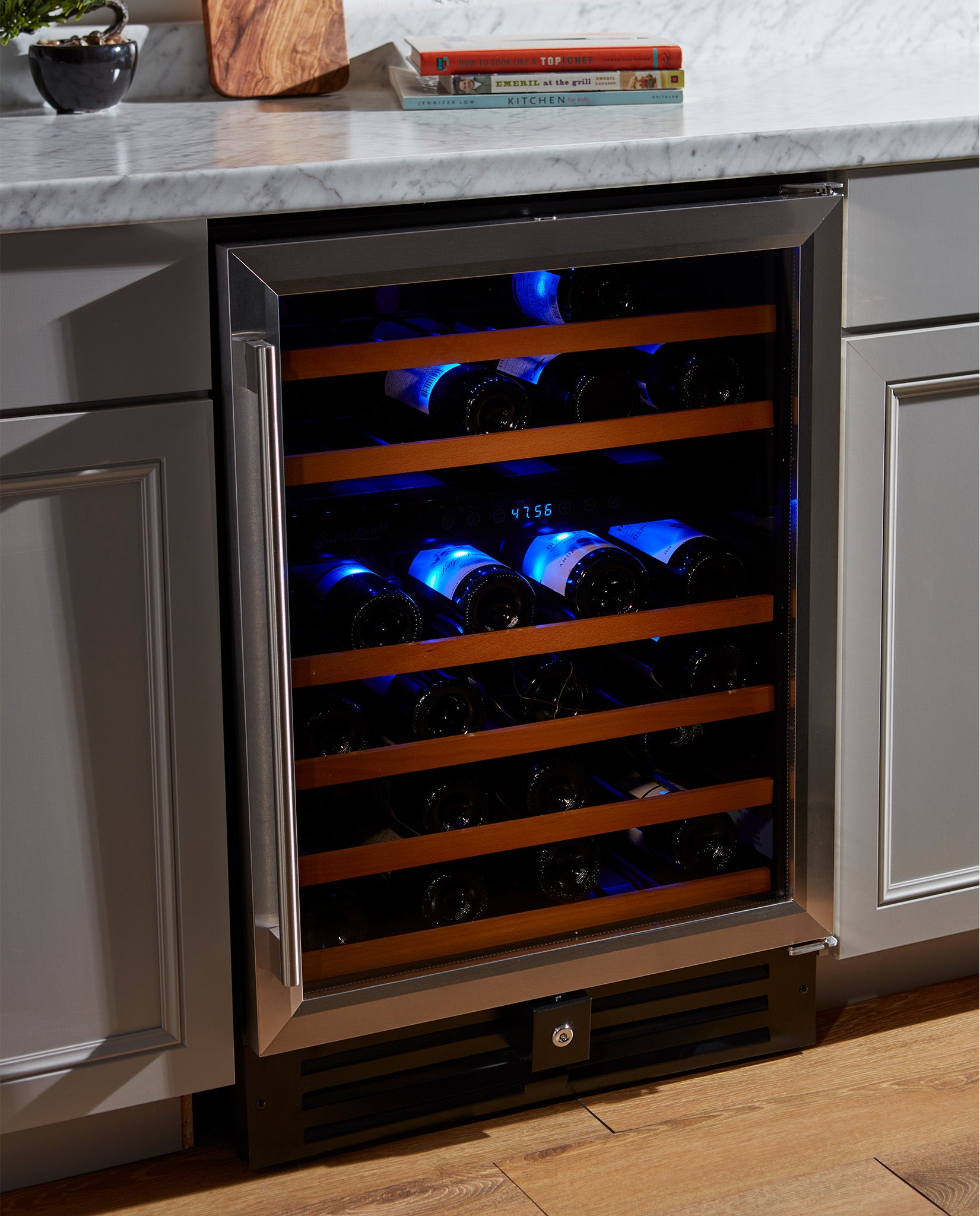 https://www.smithandhanks.com/cdn/shop/products/Smith-and-Hanks-46-bottle-Wine-Cooler-dual-zone-RW145DR-Stainless-Steel-environment_1651x2048.jpg?v=1677766035